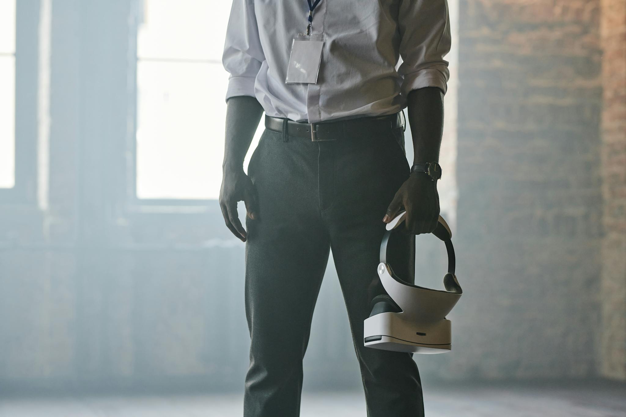 Home 8 a professional man holding virtual reality goggles