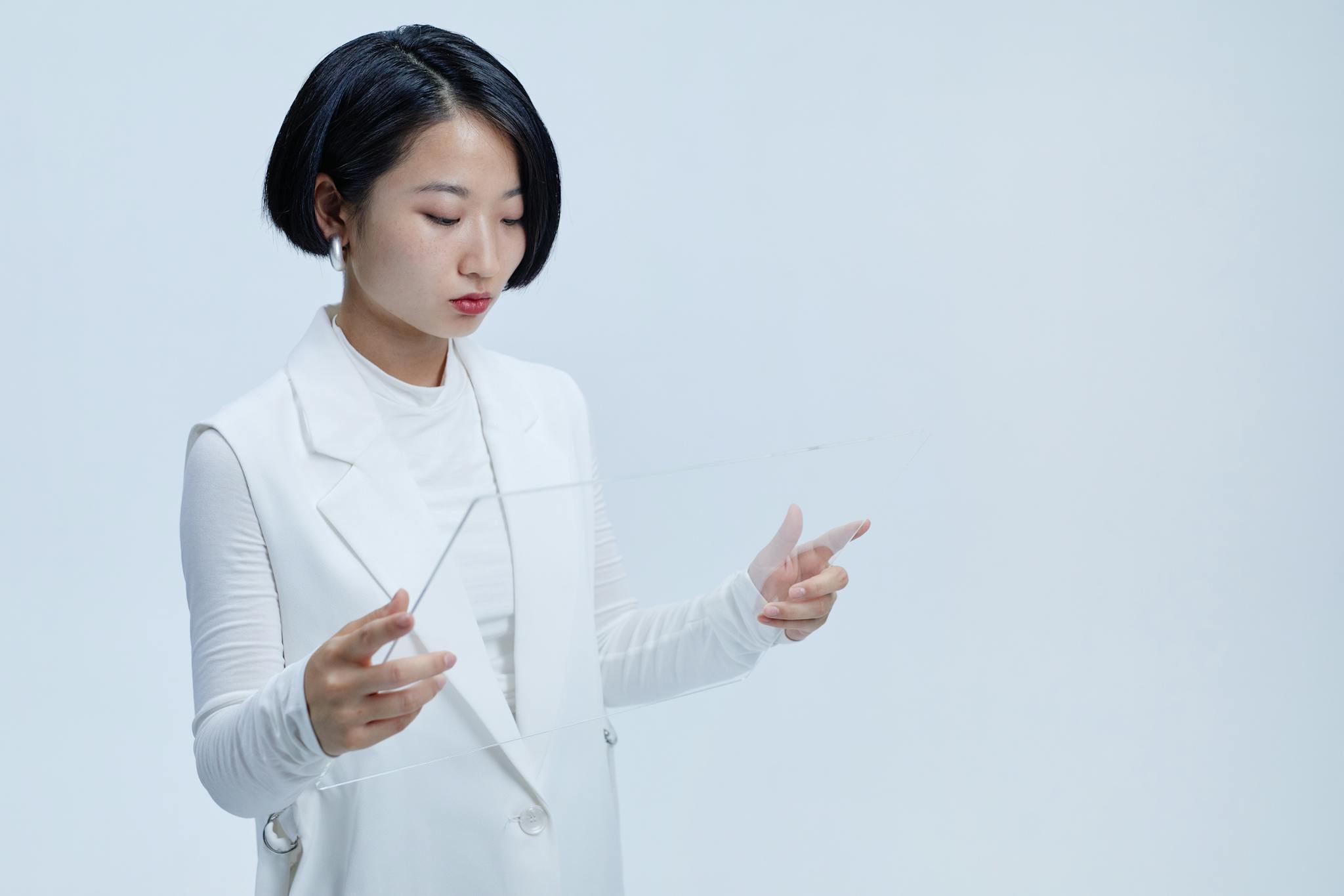 Home 10 young woman interacting with a futuristic transparent